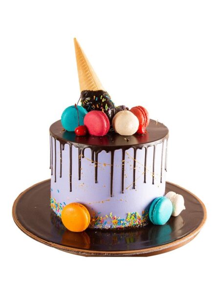 Melting Cornetto cake with ice cream cone, colorful macarons, sprinkles, and chocolate drip.