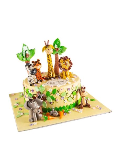 Jungle theme cake with giraffe, lion, zebra, tiger, monkey, and elephant figurines.