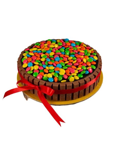 Kitkat Gem Paradise cake decorated with KitKat bars and colorful gems