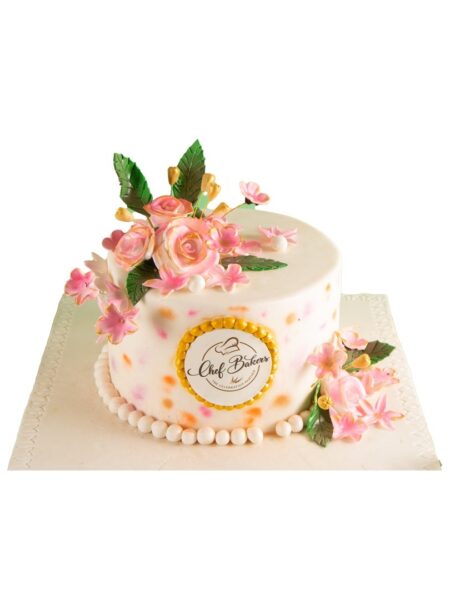 Golden rose theme cake with pink roses, golden accents, and elegant floral décor.